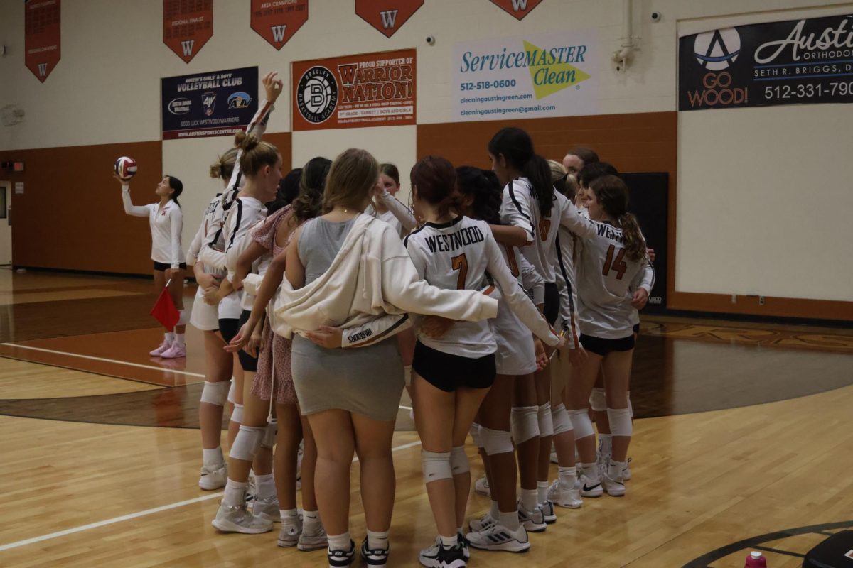 The Lady Warriors gather together during their 1 minute time out in the first set. Communication and teamwork were a big focus in practice to start the season. "No [I don't have one favorite Volleyball memory] because all of them are my favorite" Kariza Guerra '26 said.  