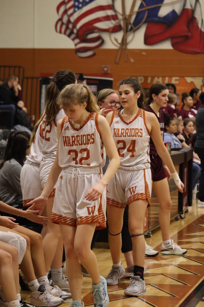 Ella Steinheider '26 and Lola Proano-Montana '26 take their seat on the bench after an eventful game. Steinheider finishes the game with 7 points and Proano-Montana with 8 points. The JV team works hard to not only drive hard to the basket but also help assist their teammates in shots.