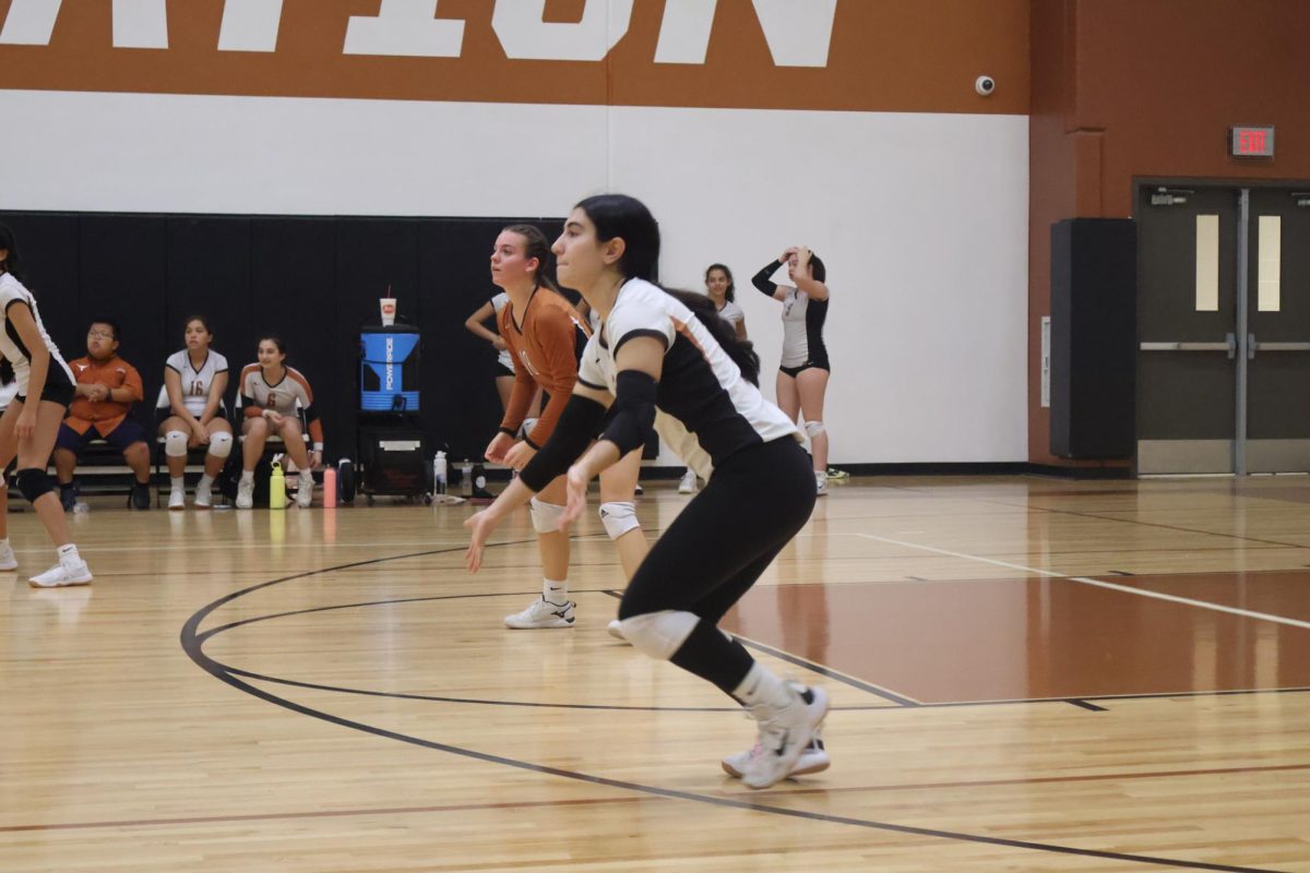 Sophia Nikazam '27 gets ready to receive a ball. The Warriors worked a lot on staying in the right positions and not letting any tips drop which helped them keep the score close to the Raiders. 
