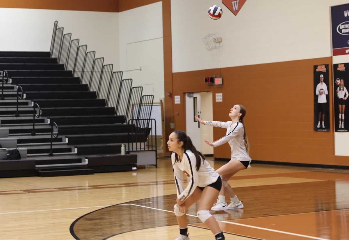 With focus and precision, Caroline Kiefer '26 serves up a storm in the second set. The Lady Warriors attempted to make a comeback after losing the first set, Kiefer in the right back position, led the Lady Warriors with serves.