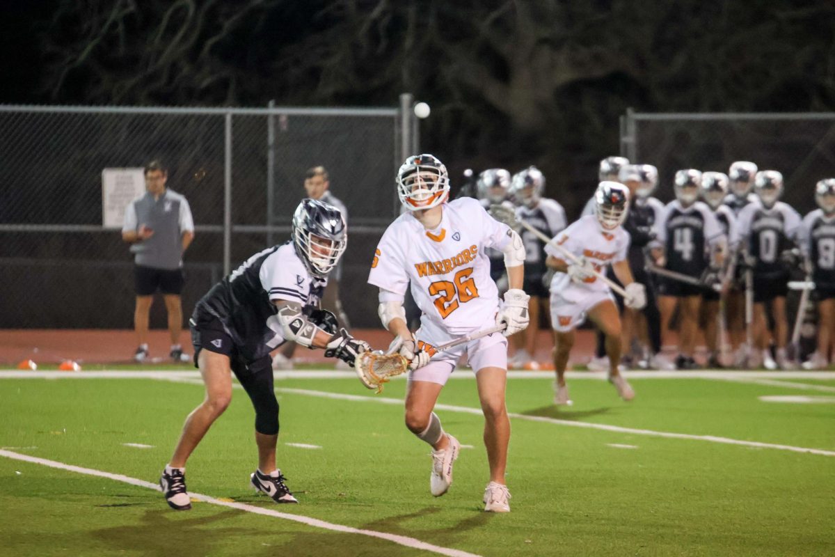 In a struggle for the ball, Truitt Forse '27 (Round Rock High School) prepares to steal the ball from a Vandegrift player behind him. Forse, an attacker, is the lone freshman on the varsity team.