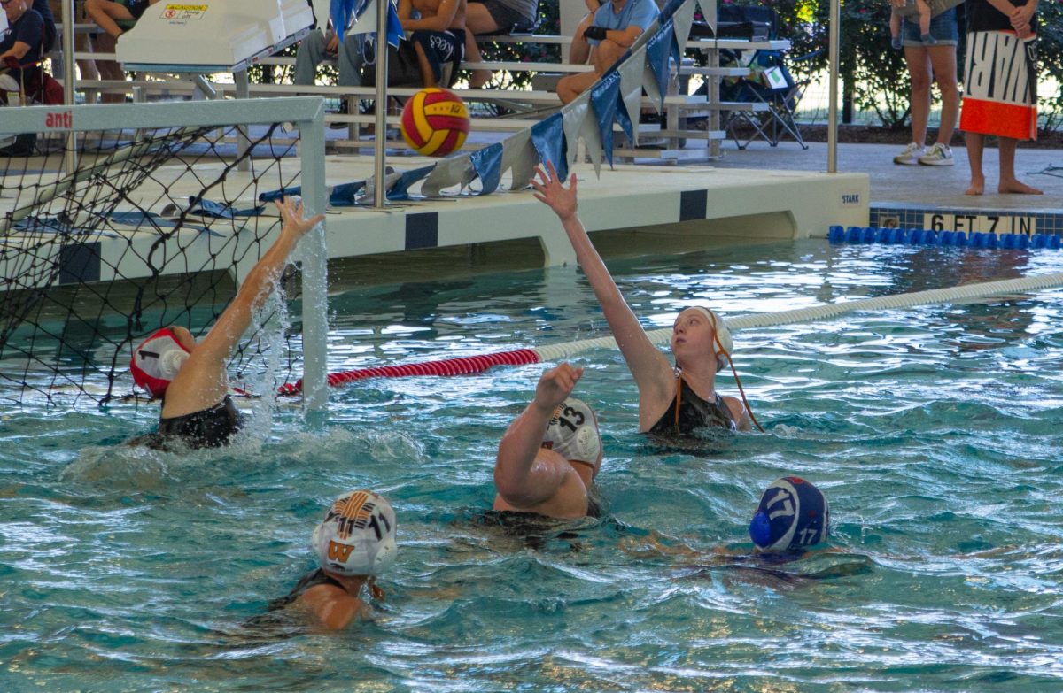 On defense, Elyse Osborn '27, Bella D'Alessandro '25, Katherine Mayer '25, and Claire Braun '25 guard the goal from the Midway Panthers. The girls worked towards strengthening their defense the entire season in preparation for the district tournament. “Our defense is really good, we just need[ed] to keep up with that. We've been working towards [that] the whole season," D'Alessandro said. 
