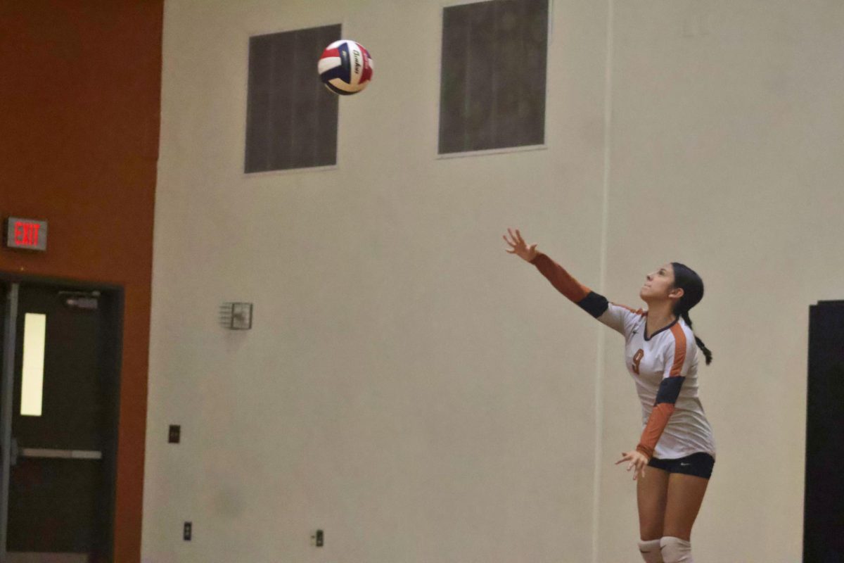 Layla Guerra '29 serves over the net. Her strong attacks helped the Warriors have a five point lead during the second set.