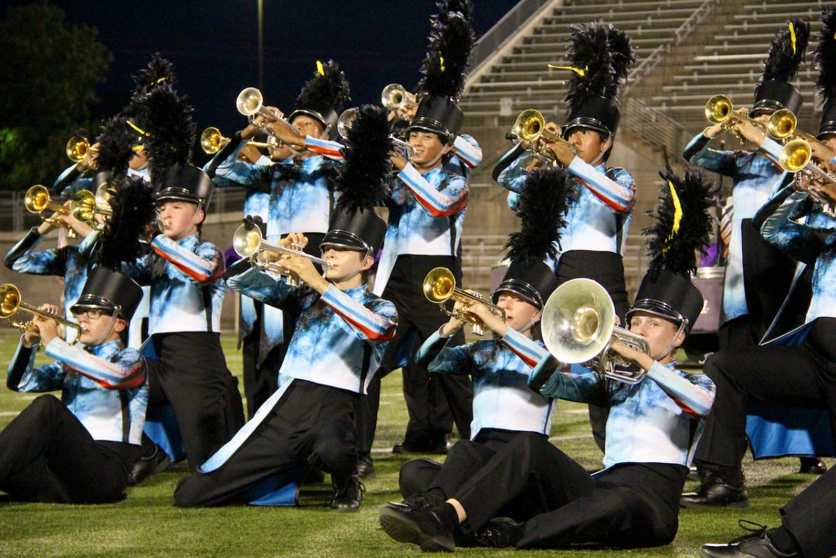 The mellophone and trumpet sections play and perform part two of their marching show Red. March-A-Thon was the first time the band performed part one and two together for an audience.