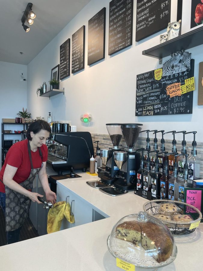 Owner Sam Bayizitlioglu cleans the coffee equipment during the busy hours of the bakery. 