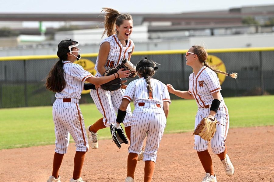 The field players rush together to celebrate after the sixth inning.