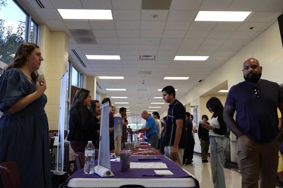 A college representative prepares to introduce her college to students and their families. On Tuesday, Sept. 5, Round Rock ISD (RRISD) held the Central Texas College Fair, where students were given the opportunity to meet admission representatives from colleges around the United States to learn more about college possibilities after high school.