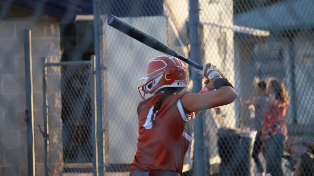 Up to bat, Sye Stone '26 is prepared to swing as hard as she can in hopes to get the ball far to advance her team in the inning. 