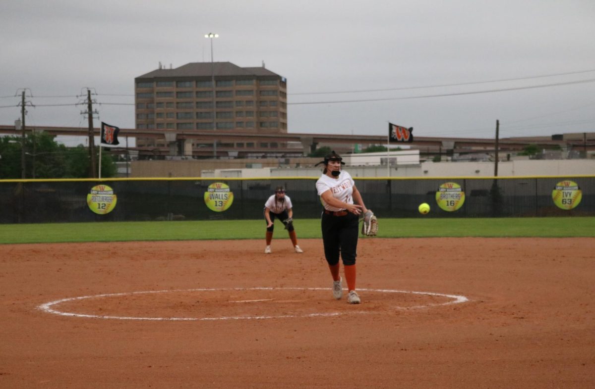 With fascinating control, Presley Leal '28 pitches a fastball over home plate.
