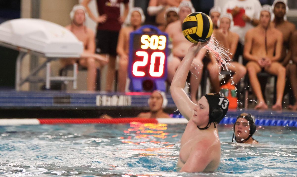 Sizing up his opponents, Patrick Preddy '28 prepares to pass the ball. The Warriors had to be strategic with their passes to ensure the ball wasn't stolen by the opposing team. 