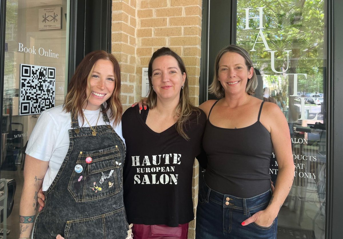 Smiling, hair stylist Kelli Golden stands next to Haute Salon Owner Katalin Kiss and hair stylist Becky Packard. The trio serve customers daily at Haute Salon. "Quality is the most important," Ms. Kiss said. "We focus most on quality and listening to our clients' needs, so we can do our best."