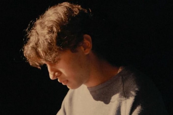 Framed in dramatic lighting director, writer, and star Kristos Puliadi poses for the poster of his debut feature film 'Thespian'. 