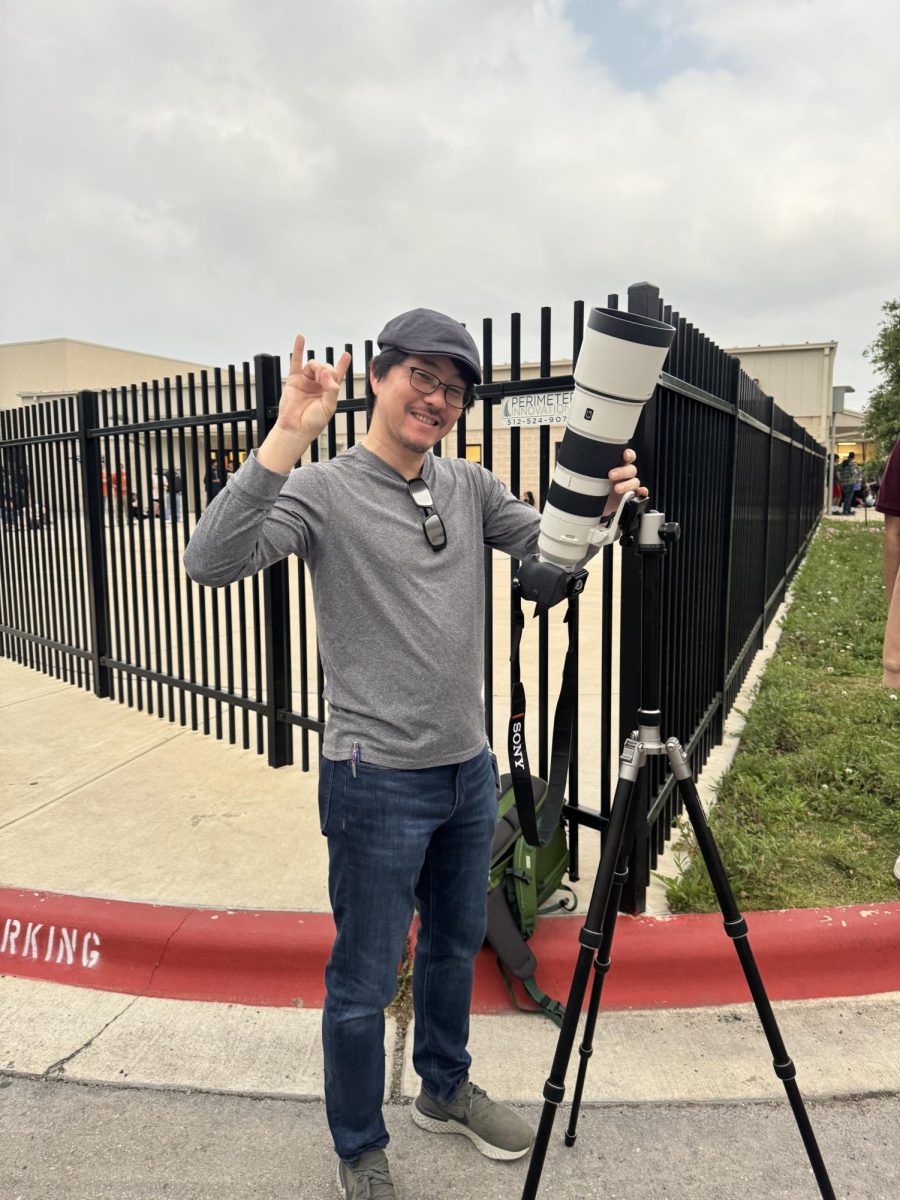 Posing with his camera, Mr.Youn prepares to photograph the eclipse. A rare scientific occurrence, this was the first time Mr. Youn had attempted to photograph a total eclipse. "Honestly, I wasn't even photographing it, I was just experiencing it,” Mr. Youn said. “You know, we built it up and the anticipation was incredibly high, but experiencing it was cooler than I anticipated.”