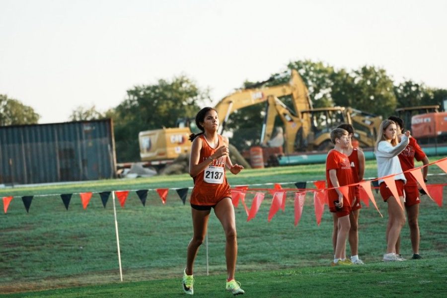 Priya Gangadharan '23 races to the finish line in the 5000-meter run. The team worked hard all summer in preparation for this meet and the rest of our season. 