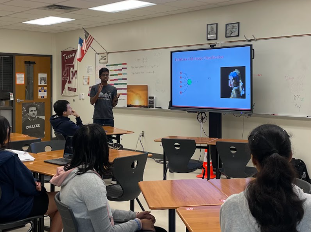 Animated, AI/ML Club Vice President Aditya Madhan ‘24 leads a lesson on image classification as club members look on. Officers plan the lessons around club members' previous knowledge and understanding. "AI is definitely a complicated thing to teach," club President Raghav Aggarwal '24 said. "I think the biggest thing is how we're gonna make this complicated stuff easy to understand.”