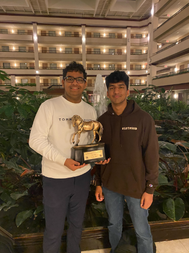 Seniors Ishan Sharma and Ayush Tripathi hold the golden Tournament of Champions trophy after defeating Montgomery Bell Academy students and winning finals on a 2-1 decision. Sharma and Tripathi competed at the University of Kentucky for three days with a total of 11 rounds and only one loss. “It means everything to win the TOC and it's a testament to the sacrifices and the time we have put in for the past four years,” Tripathi said.